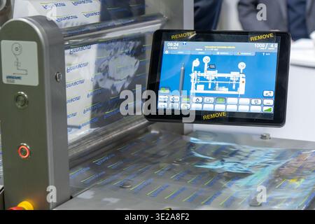 Helsinki, Finland - March 11, 2026: A close-up view of a modern packaging machine featuring a digital touchscreen control panel displaying operational Stock Photo