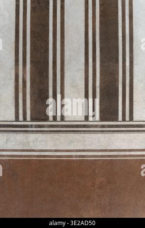 Brown and white striped painted wall creating a textured background pattern Stock Photo