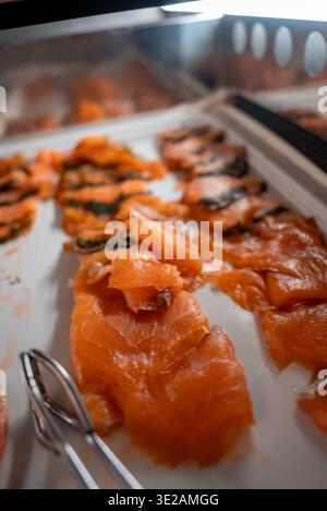 Smoked salmon rows on chilled buffet tray in Zermatt, Switzerland Stock Photo