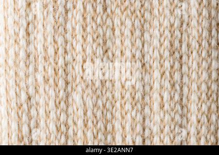 Light alpaca wool knitted textile macro natural fabric texture background Stock Photo