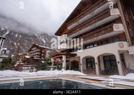 Framed black and white portrait in wood paneled Alpine inn, Oberlech Stock Photo
