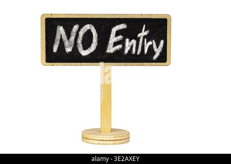 A handwritten NO Entry warning written in white chalk on a small rectangular blackboard sign mounted on a wooden stand, isolated on white background w Stock Photo