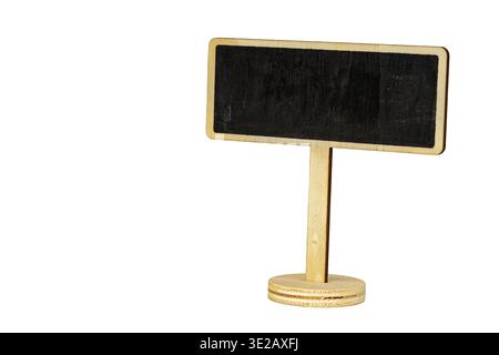 Miniature wooden blackboard sign with chalk surface mounted on a circular stand, isolated on white background. Perfect blank copy space for handwritte Stock Photo