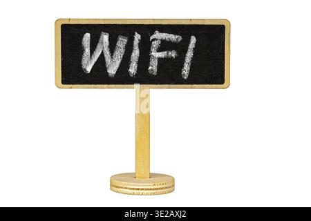 A small rustic wooden stand holds a blackboard sign with handwritten chalk WiFi lettering, isolated on a clean white background with copy space for cr Stock Photo