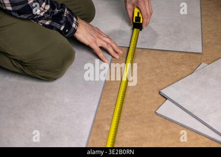 stone texture vinyl tile flooring installation Stock Photo