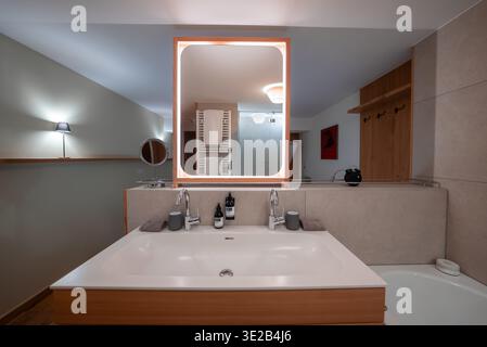 Contemporary hotel bathroom with double vanity in Oberlech, Austria Stock Photo