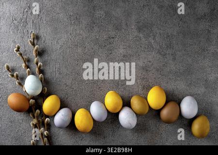 Natural dyed easter eggs. Happy Easter. Congratulatory easter background. Easter composition on grey concrete backgrount Stock Photo