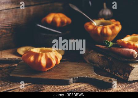 Food, Preparing yellow pattypan squash for stuffing with minced meat Stock Photo