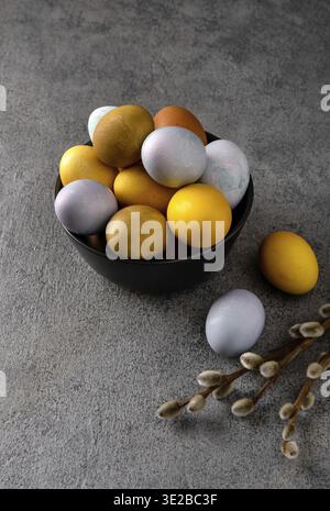 Natural dyed easter eggs. Happy Easter. Congratulatory easter background. Easter composition on grey concrete backgrount Stock Photo