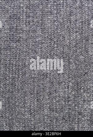 Textile vertical background - woven texture of gray wool jersey knitted fabric close up Stock Photo