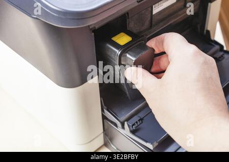 Replacement of toner cartridge in laser multi function device in office Stock Photo