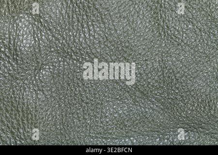 Textured background from dark olive green leather close up Stock Photo