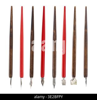 Collection from red and brown penholders with various nibs isolated on white background Stock Photo