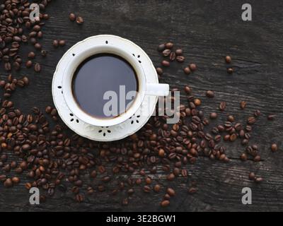 Coffee. Cup Of Coffee with Beans on a Wooden Background. Border Design Stock Photo
