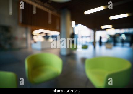 Blurred office lounge interior abstract workspace background, defocused corporate hall seating area soft light bokeh modern architecture minimal compo Stock Photo
