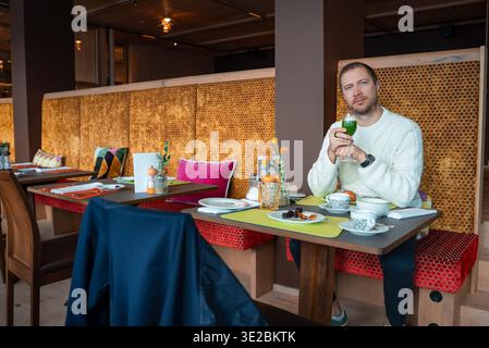 Hotel restaurant in Oberlech with honeycomb walls and breakfast setup Stock Photo