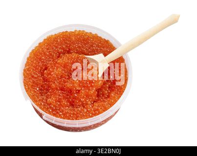 Plastic container with salted russian red caviar of pink salmon fish and big wooden spoon isolated on white background Stock Photo