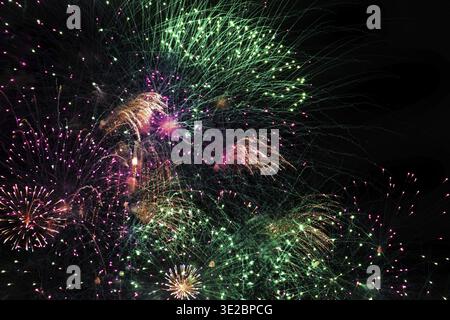 Fireworks festival on dark sky . countless small colored bright lights on a black background Stock Photo