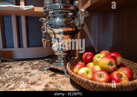 Silver samovar and apples on marble in Oberlech, Austria lounge Stock Photo