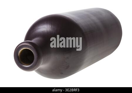 Overturned black ceramic bottle isolated on white background Stock Photo