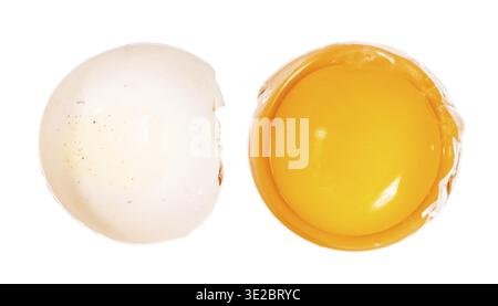 Top view of separated egg yolk in shell and empty half of shell isolated on white background Stock Photo