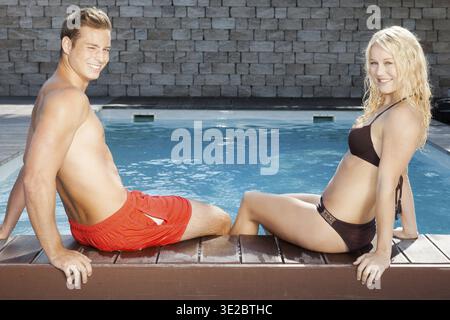 A young attractive couple, 30 years old, relaxing at the swimming pool, man, woman, blonde, blonde, Federal Republic of Germany Stock Photo