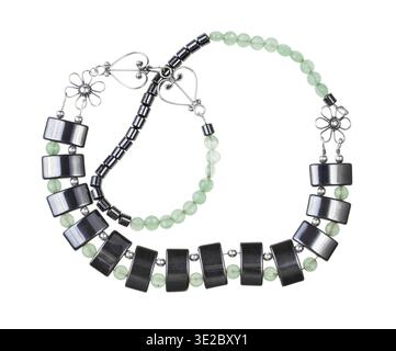 Tangled hand crafted necklace from green jade, black hematite and silver beads isolated on white background Stock Photo