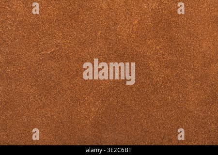Textured background from orange brown suede close up Stock Photo