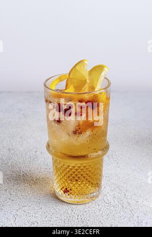Vibrant and sparkling non-alcoholic punch is perfect for summer gatherings . Colorful cocktails in glasses on white table. Fresh holiday drinks Stock Photo