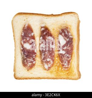 Top view of open sandwich with toast and three slices of cured sausage isolated on white background Stock Photo