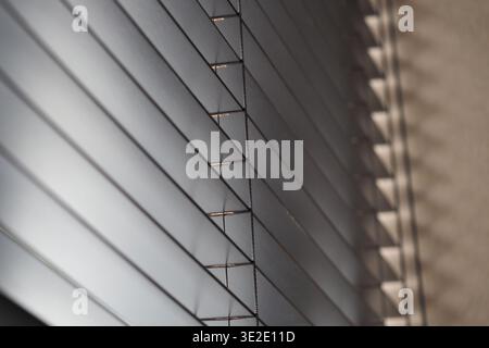 Light filtering through window blinds at home Stock Photo