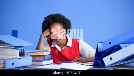 Overworked, files and black woman with sticky note in office, burnout and tired for mental exhaustion. Workload pressure, fatigue and person with do Stock Photo