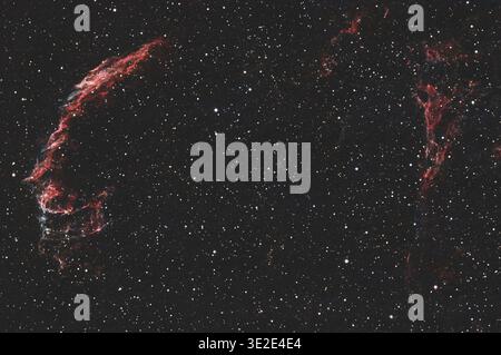 Eastern Veil Nebula glowing in deep space within the Cygnus constellation Stock Photo