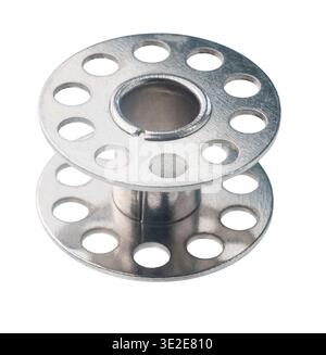 Empty bobbin for sewing machine on white isolated background Stock Photo