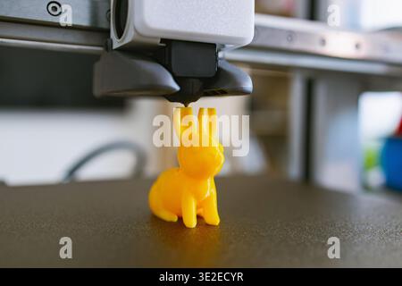 3D Printer Creating Yellow Bunny Stock Photo