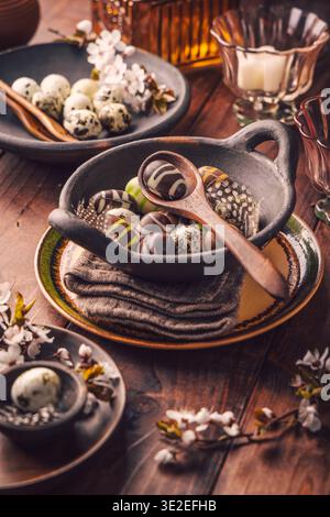 Easter place setting with sweet chocolate eggs, spring celebration Stock Photo