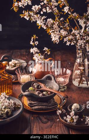 Easter place setting with sweet chocolate eggs, spring celebration Stock Photo