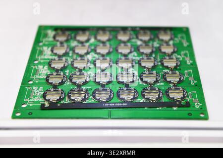 Printed circuit board (PCB) panel with gold plated connectors ready for SMT assembly process. Stock Photo
