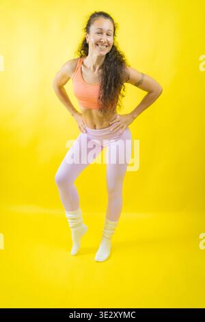 Happy fitness woman embracing active healthy lifestyle Stock Photo