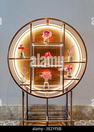 A still life with luxury objects in a small display case is located in the hallway of a building in Riyadh, Saudi Arabia. Stock Photo