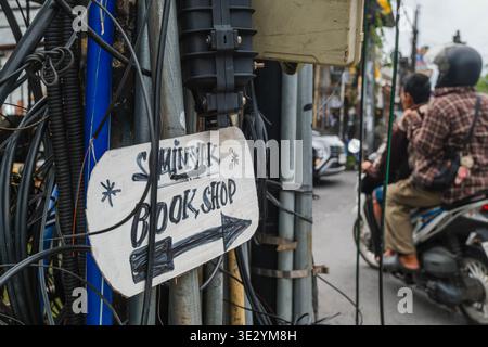 Seminyak Book Shop Directional Sign on a Utility Pole Stock Photo