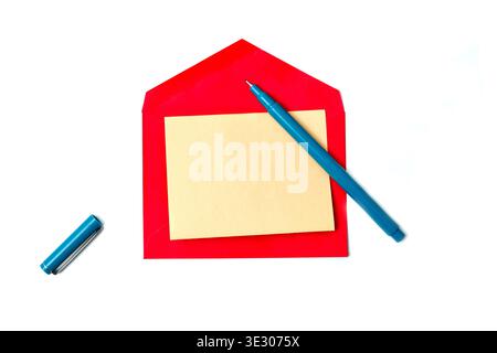 A clean, top-down studio shot of a vibrant red open envelope placed on a pure white background. Inside the envelope is a square, blank light-yellow no Stock Photo