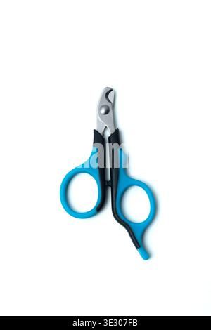 A pair of blue and black pet nail clippers with ergonomic handles and a curved metal blade, isolated on a white background, showcasing essential groom Stock Photo