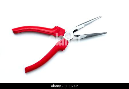 A close‑up of long‑nose pliers with red ergonomic handles and serrated metal jaws, isolated on a white background, showcasing a precise hand tool used Stock Photo
