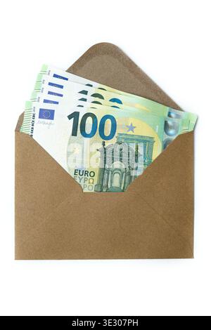 100 Euro banknotes in a brown craft paper envelope on white background. Cash gift or bribe concept: Euro currency inside an open craft envelope. Stock Photo
