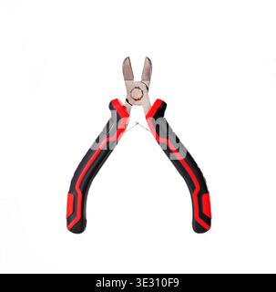 Cutting pliers with red and black handles isolated on white background. Professional wire cutter hand tool. Stock Photo