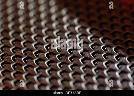Abstract metal grid texture with repeating geometric pattern Stock Photo
