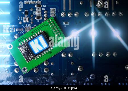 Bavaria, Germany - March 20, 2026: PHOTO MONTAGE, A microchip with an AI symbol on a circuit board represents artificial intelligence and modern technology. The image illustrates the digital processing of data and the importance of AI for innovation and automation. *** FOTOMONTAGE, Ein Mikrochip mit KI-Symbol auf einer Leiterplatte steht für künstliche Intelligenz und moderne Technologie. Das Bild zeigt die digitale Verarbeitung von Daten und die Bedeutung von KI für Innovation und Automatisierung. Stock Photo
