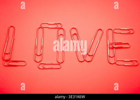 Love, a word made of paper clips. Stock Photo