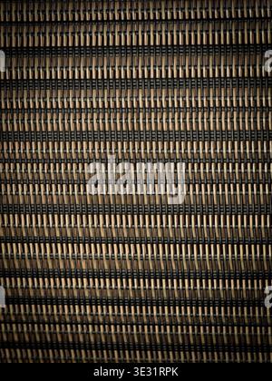 Macro closeup of black and beige woven rattan texture pattern with repetitive abstract design Stock Photo